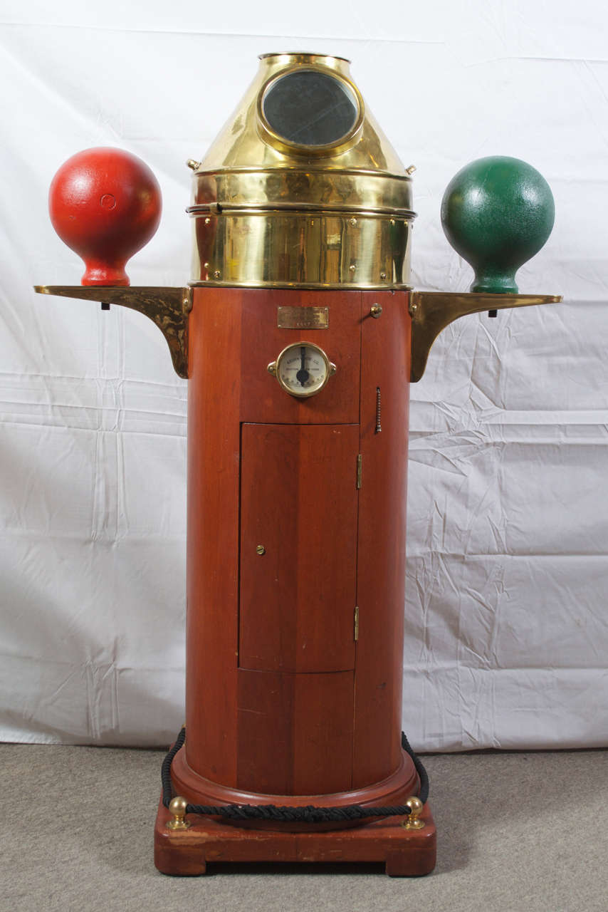 This is a late 20th century binnacle, model number 3097. Was manufactured by Kelvin & Wilfrid O. White Co., of Boston and New York. The 7 1/2 compass, sits in a 10 3/4 floating dial. The compass is covered with its original Brass shield/hood, with