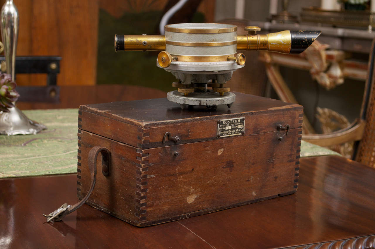 Bostrom-Brady(Atlanta, Ga.) manufacturers of fine tools & surveying equipment produced this contractors level/transit housed in wooden case with dovetailed corners, hinged cover and hook fasteners on the front. The leather carrying strap handle