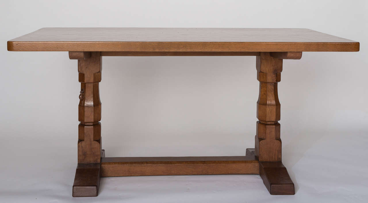 A Robert " Mouseman " Thompson Oak Dinning Table.
The table of rectangular form, on faced baluster supports linked by a stretcher.
England circa 1955.
Carved Mouse Signature.
151cms w x 85cms d x 73cms h