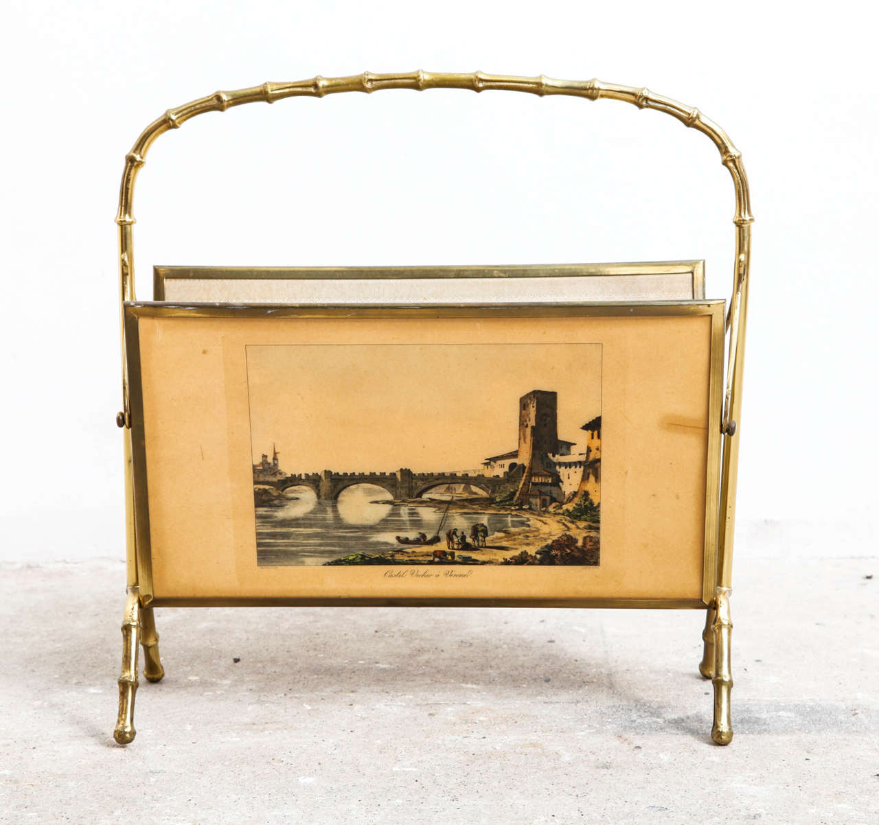 A beautiful faux bamboo magazine rack, made of brass. Made in Italy, in good condition with nice patina on the brass.