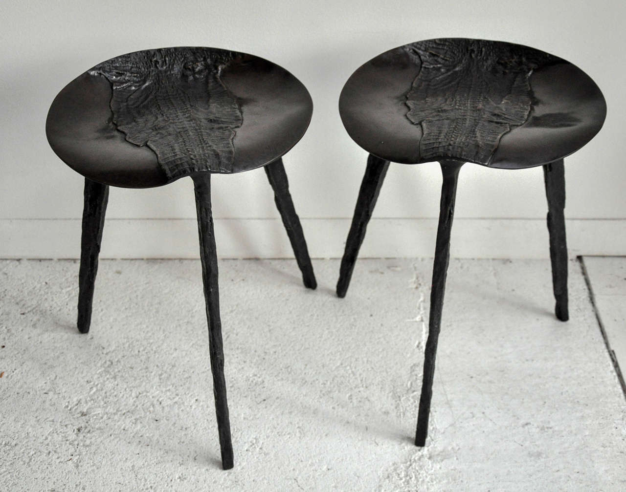 Pair of brass alligator stools handsomely done in a dark brown finish.