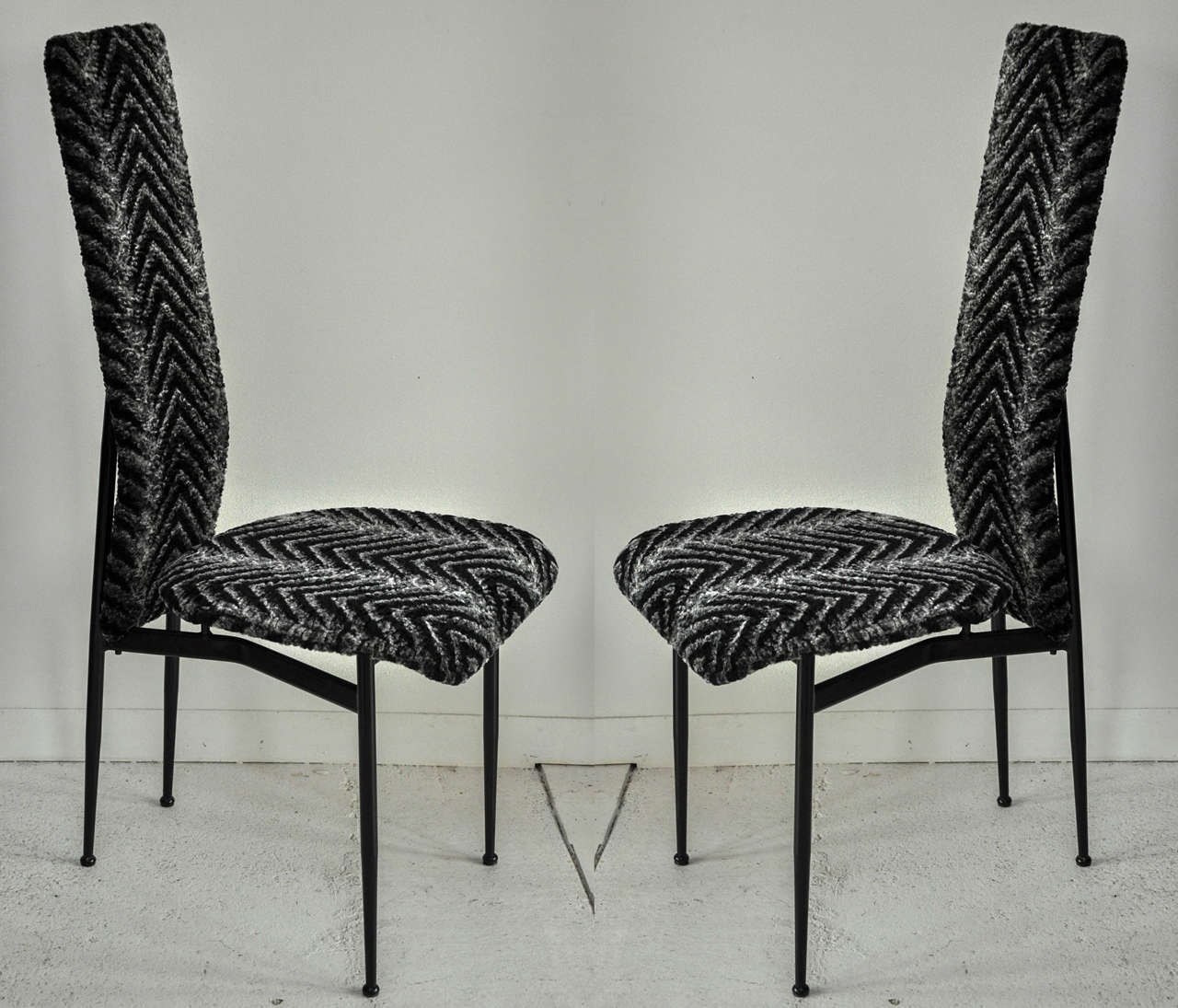 Beautiful pair of Mid-Century Modern chairs recently reupholstered in a faux fur chevron for a modernized makeover.