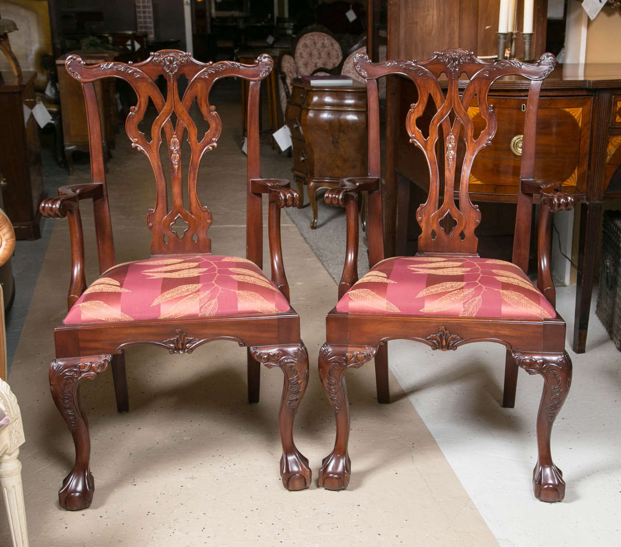Set of Six Chippendale Style Mahogany Ball and Claw Dining Room Chairs.  All accommodating arms - which are extremely comfortable at any table setting.  A dynamic symbol of 18th century furniture - this set is perfect for any dining area, kitchen,