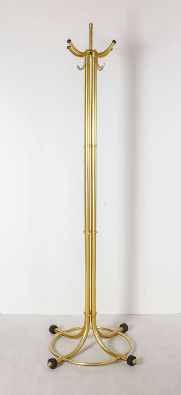 Very impressive coat rack or hat stand by Warren McArthur in a rare gold anodized finish. A fine example of his wonderful machine age design and detailing. Please contact for location. 