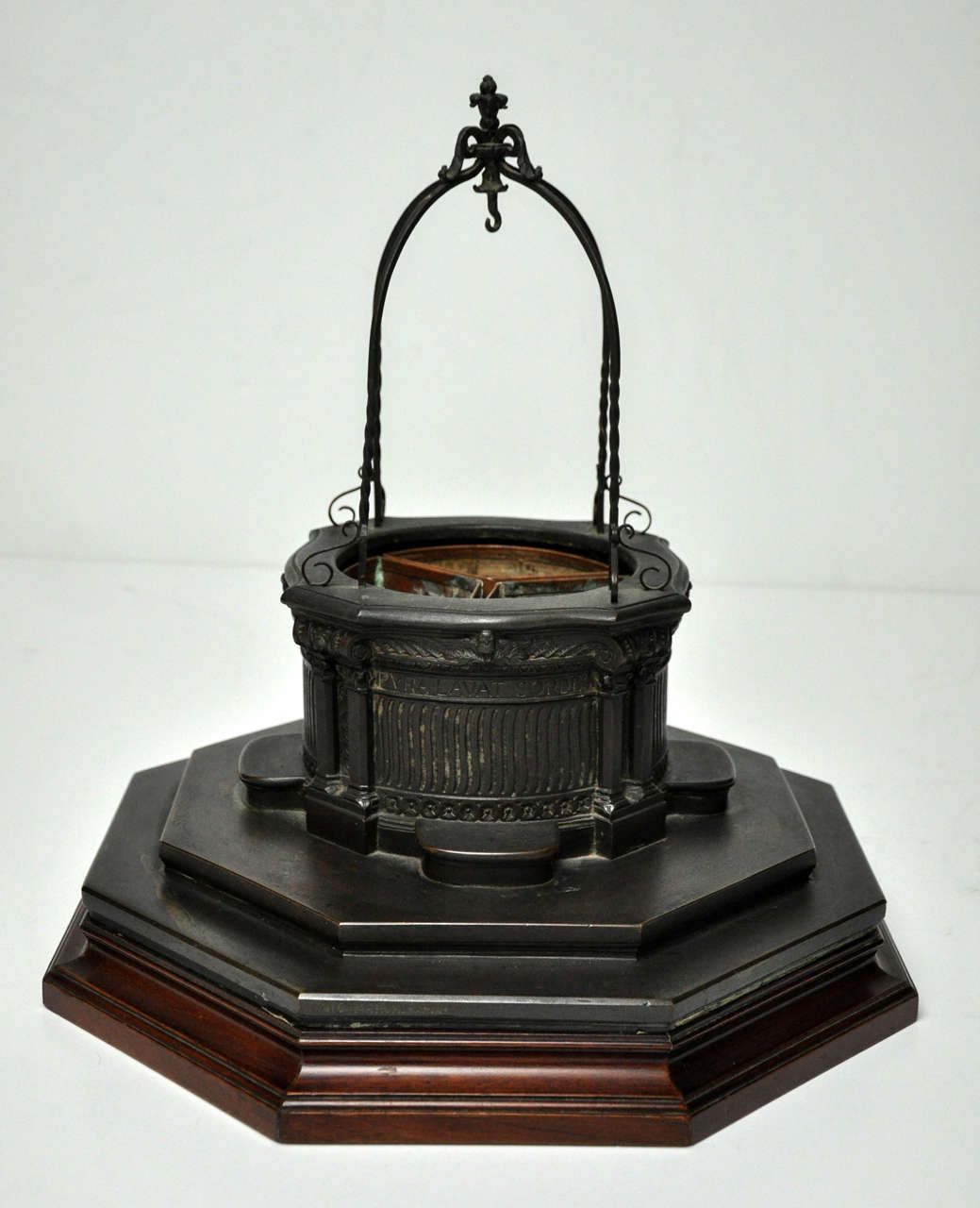 Fine detailed miniature Italian well head on a walnut base. Italian, c- 1850, now fitted with copper inset planters. Signed 