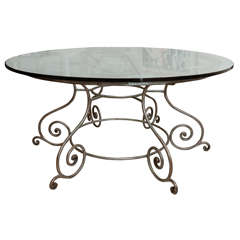 Round Glass Top Dining Table with Attractive Wrought Iron Base