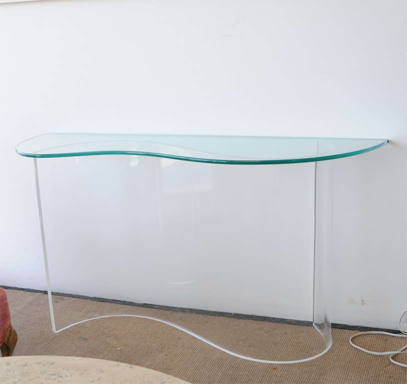 Sculptural console table will float your favorite items as if on a wave.  Top is tempered glass and base is curved acrylic.
(Measurement for the glass: 48.5 x 13.5 x 3/4 thick