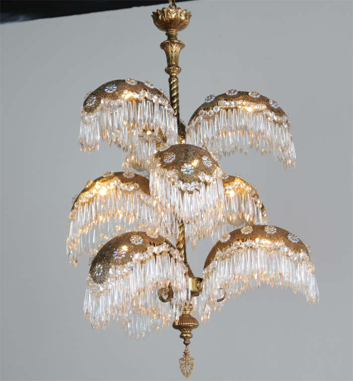 A Very Grand Italian Art Deco Palm Chandelier, 9 Fronds Dripping with Hundreds of Crystal Prisms, Aurora Borealis Rosettes, Brass Filligree Detailing. 9 Light.