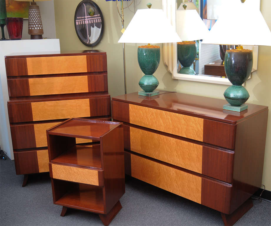 Reduced from $3,500 for Saturday sale. Absolutely beautiful design, this mahogany and bird's-eye maple gentleman's chest, highboy or dresser has a sleek streamline moderne form from the forties with round edge drawers and a stylized splayed foot.