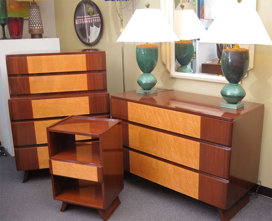 ..REDUCED FROM $3,650 FOR SATUTRDAY SALE..Absolutely beautiful design, this mahogany & birdseye maple dresser has a sleek streamline moderne form from the forties with round edge drawers and a stylized splayed foot.  Versatile in style, it blends