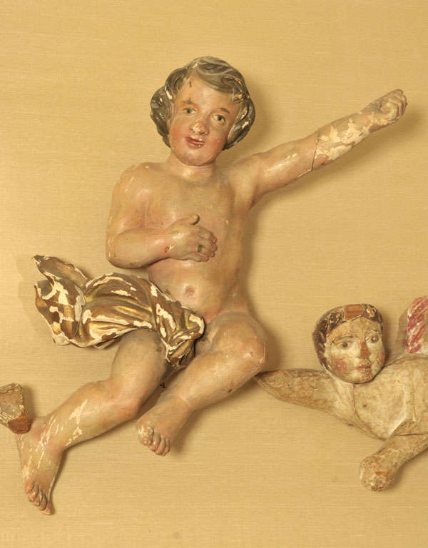 Carved A pair of 17th century Dutch polychrome painted carved putti/cherubs For Sale
