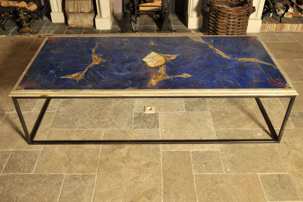 Intartia of Lapis Lazuli coral marble, malagite and mother of pearl, on iron frame. Total height 45 cm.