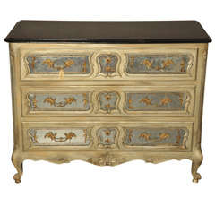 A 19th century French Rococo commode with three drawers