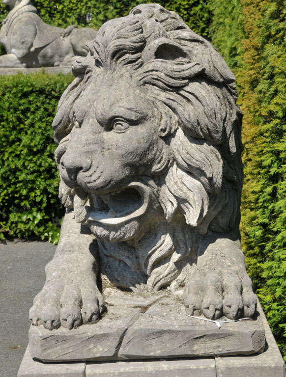 A lareg pair of French sculpted limestone models of lions on plinths 2