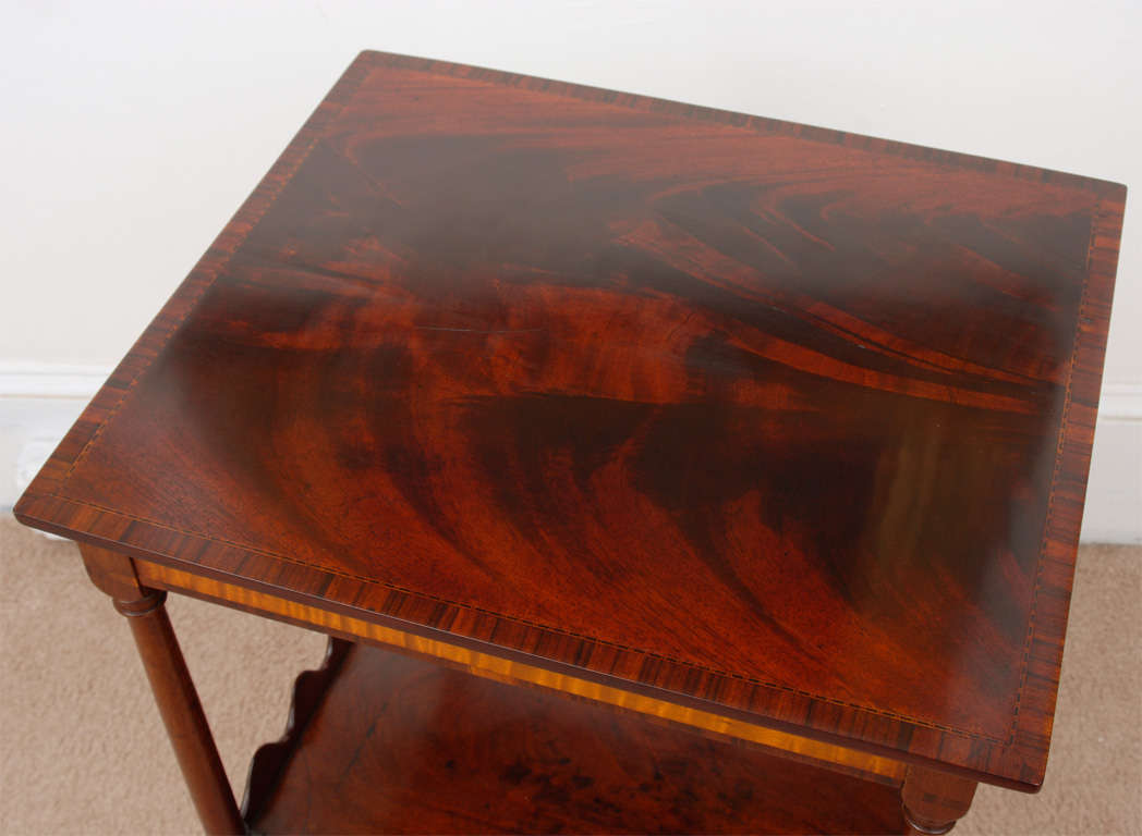 Exceptional stand-rare form. The quality of construction is typical of a master cabinet maker. Cherry with mahogany and tiger maple veneer and ash secondary wood. The brass knob is a 20th century replacement.