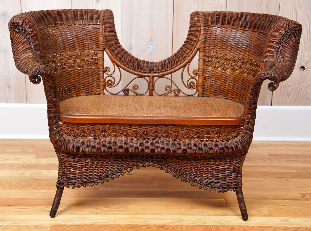 Exceptional antique wicker settee.