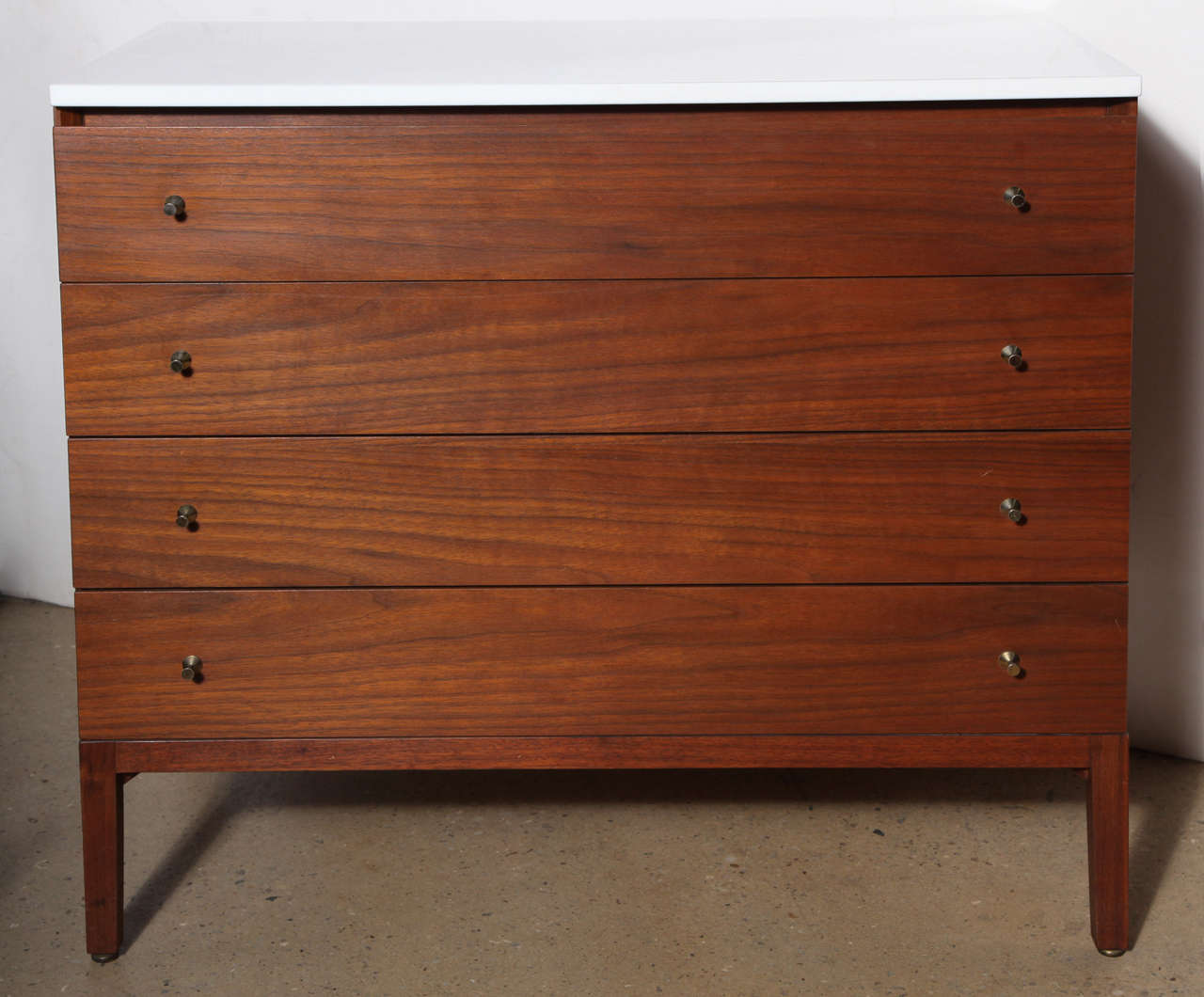 rare Paul McCobb for Calvin, Grand Rapids Modernist 4 drawer Walnut Dresser with original White Milk Glass top and hour glass hardware.  Extremely clean, original condition.  Metal Label inside

*COSMO SUMMER HOURS* 
open Monday-Thursday