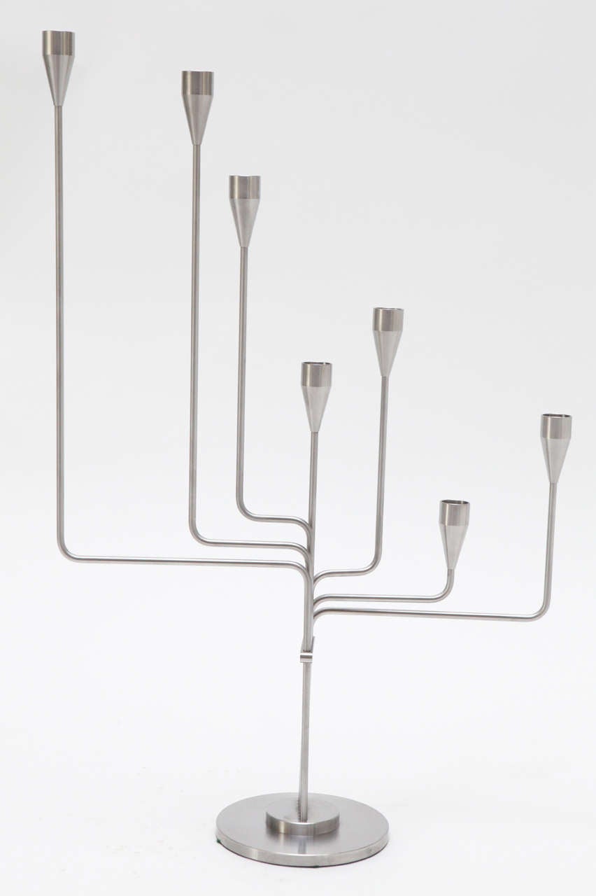 An articulated, seven-arm candelabra by Piet Hein that lends itself to an endless number of configurations, but was designed to replicate the Big Dipper of the Ursa Major constellation in plan view.