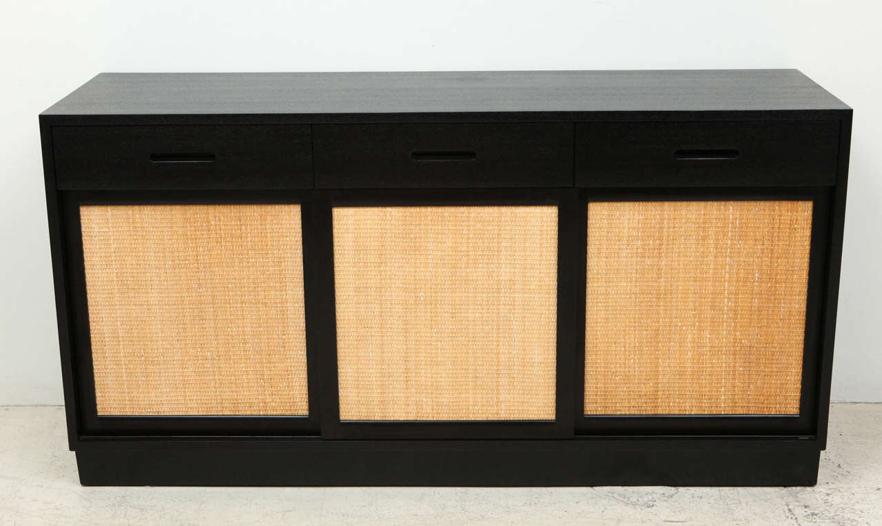 Mahogany Credenza with sliding grasscloth covered doors by Edward Wormley for Dunbar.