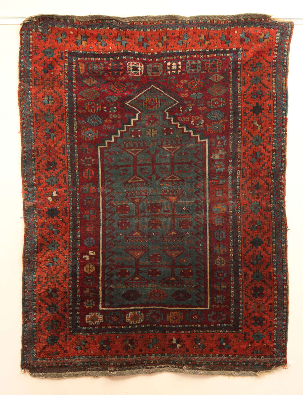 19th C. South East Anatolian village prayer rug.  Colors:  burnt orange, teal blue, wine red, touches of yellow and ivory.