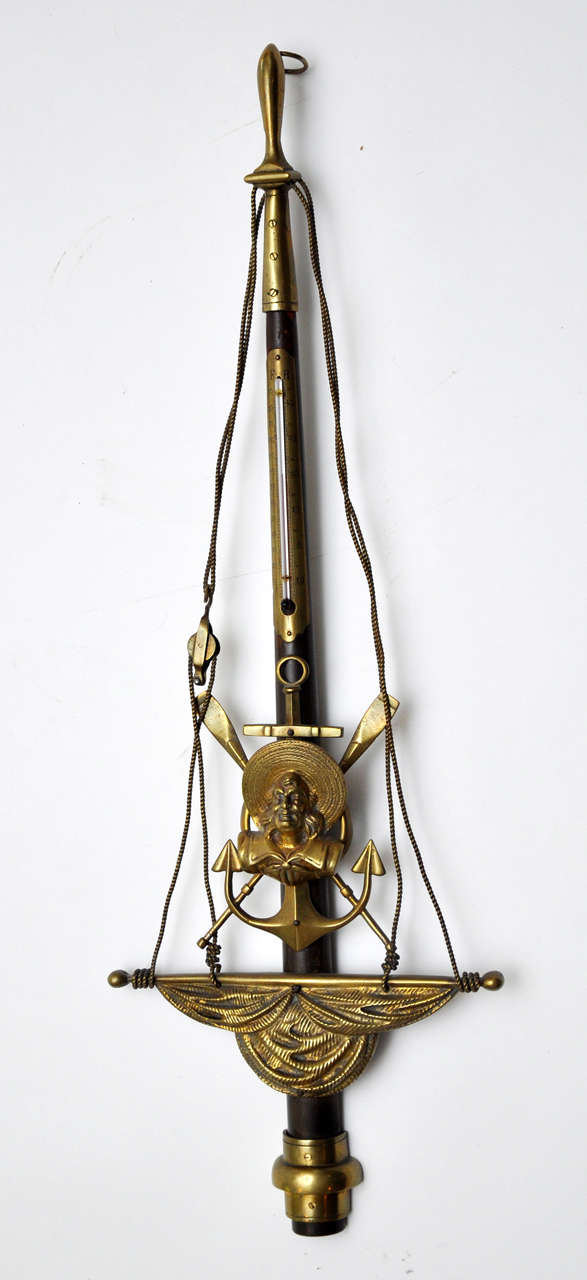 An unusual nautical themed thermometer with brass mounts of a sailor, ropes and a sail. Tube replaced.