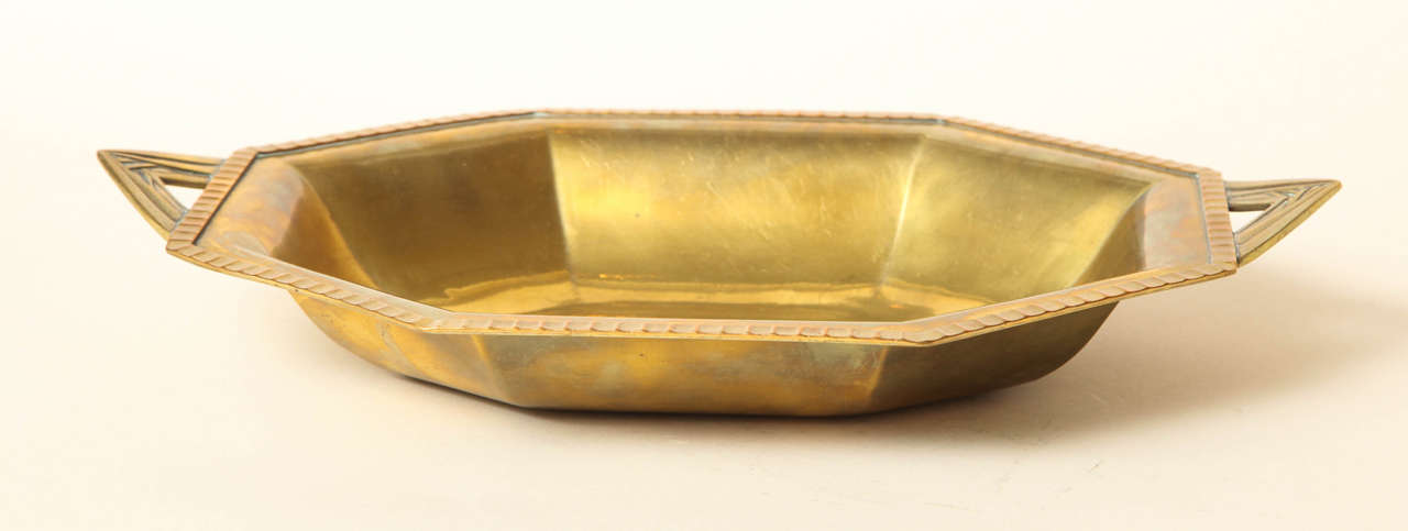 Octagonal reddish brass body with fluted border all around and triangular geometric yellow brass handles.

(Price shown is reduced price, no further trade discount)