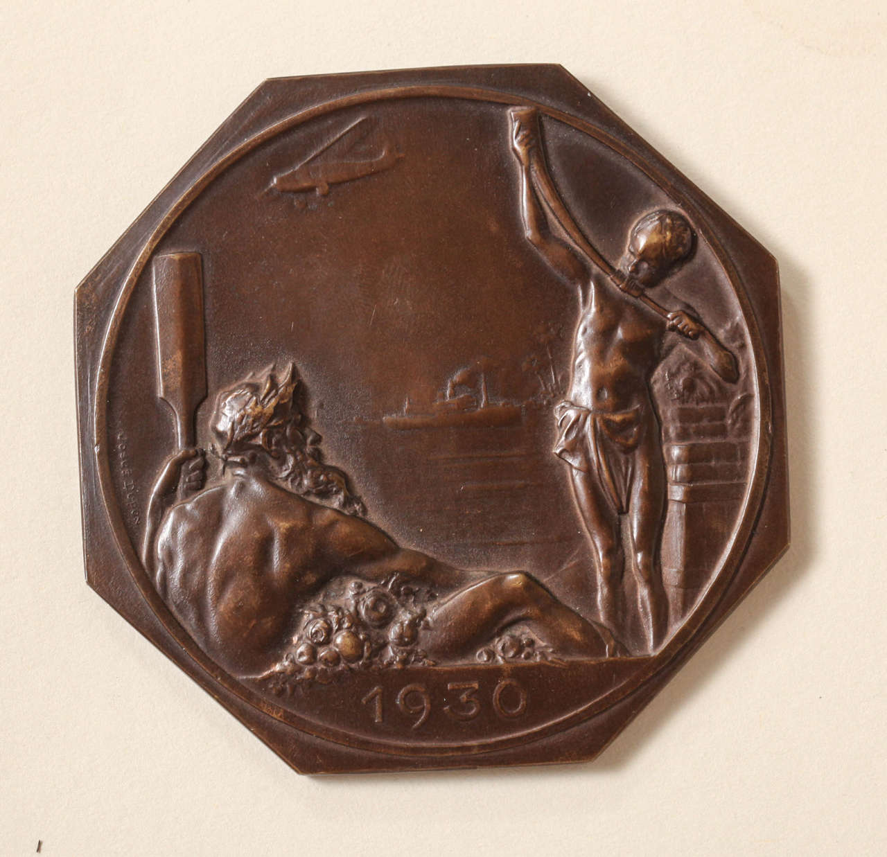 Belgian Art Deco bronze medal in high relief
Commemorating the Exposition Internationale, Antwerp, 1930

Hallmarked J Fonson on edge.
The Fonson Foundry was the major rival to the French Mint, Monnaie de Paris, for decades and produced some of the