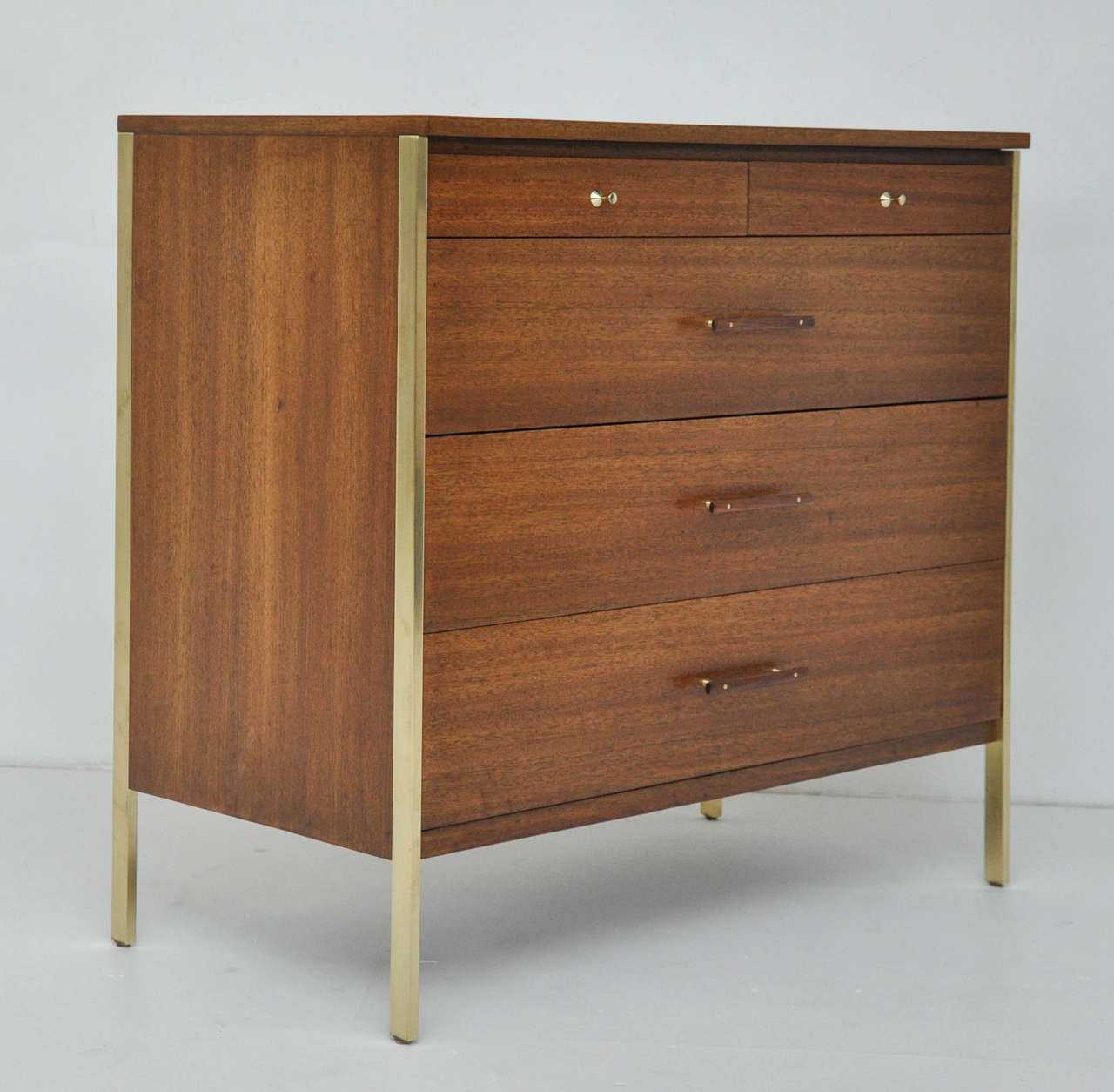 Walnut and brass chest by Paul McCobb for Calvin Furniture. Fully restored and refinished.