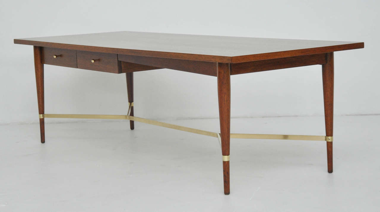 Walnut finish coffee table with brass stretcher. Designed by Paul McCobb for Calvin Furniture. Fully restored and refinished.