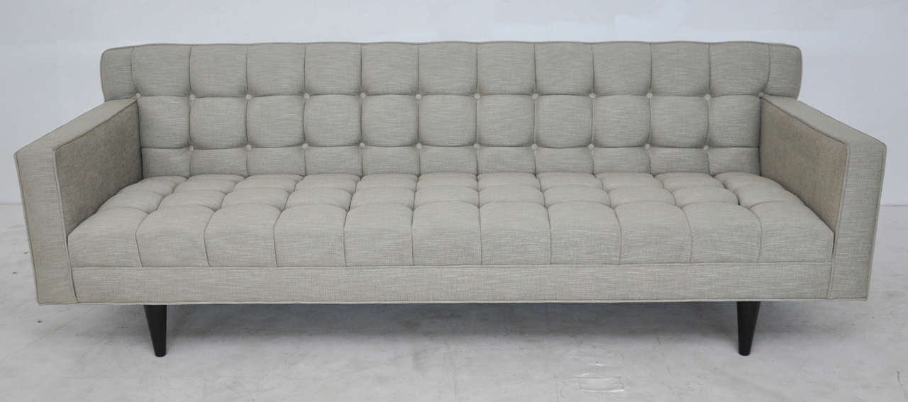 Tufted Dunbar sofa model 5136 by Edward Wormley, circa 1950s. Original dark ebonized mahogany legs. Newly upholstered.