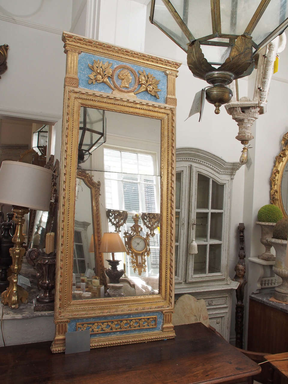 18th century period Swedish trumeau mirror with top center medallion carving of a man's face. Some refreshed paint.