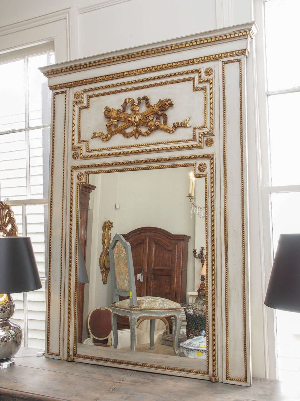 19th century French giltwood trumeau mirror Louis XVI style with classical bow and arrow cartouche. Refreshed paint.