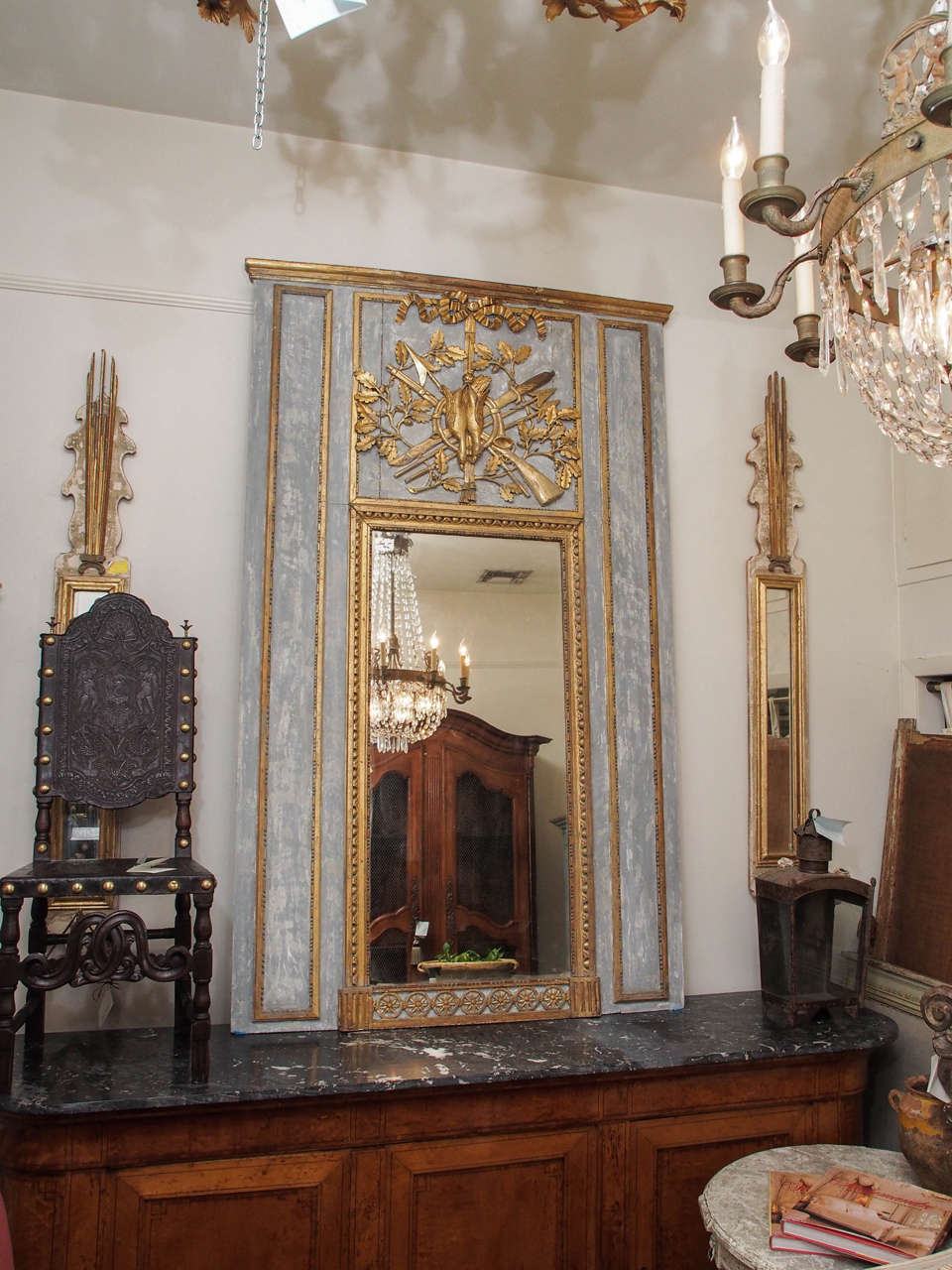 18th century Louis XVI gilt wood trumeau mirror with a bird hunting theme cartouche. Refreshed paint.