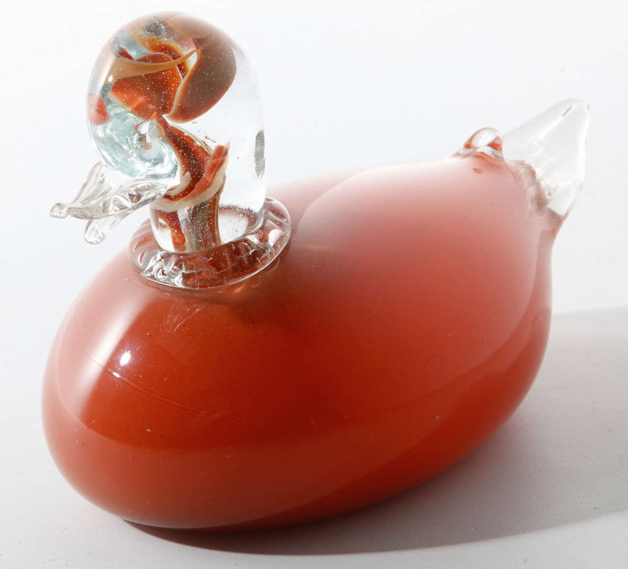 Handblown glass bird sculpture,amber and clear glass.
L.24cm-H.16cm-D.12cm