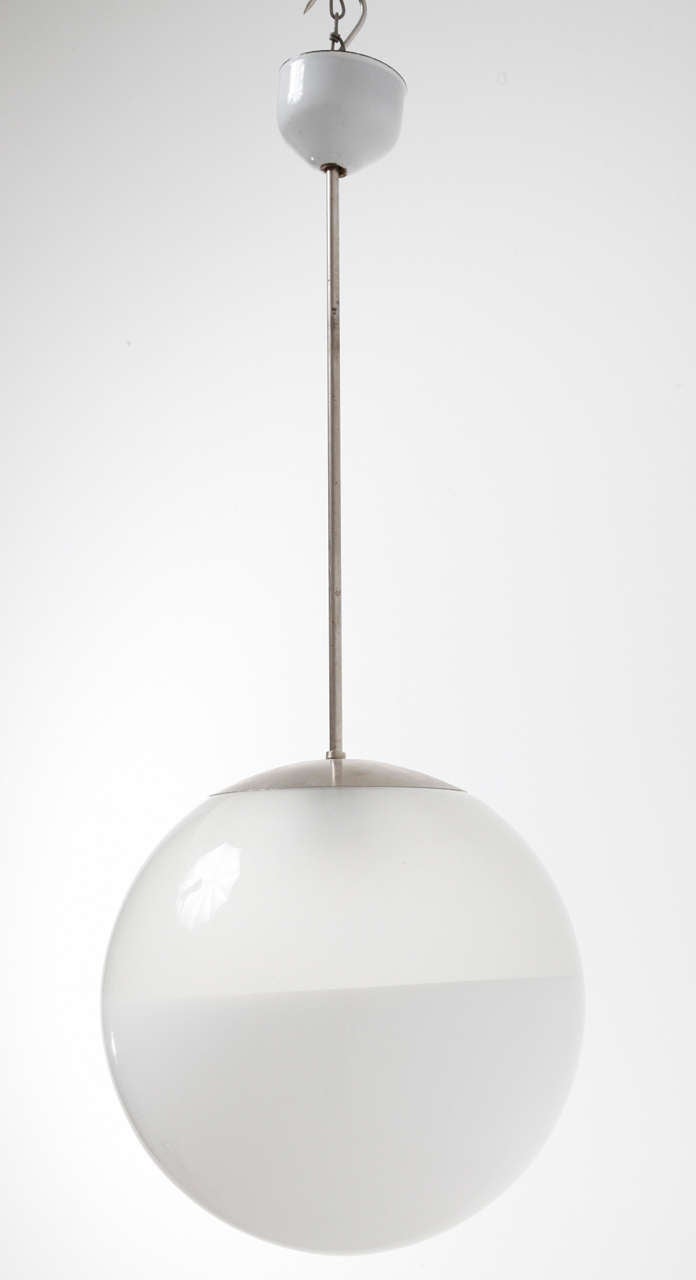 Opal/clearglass light attached to a metal chromed hanging rod.
Four pieces available.
