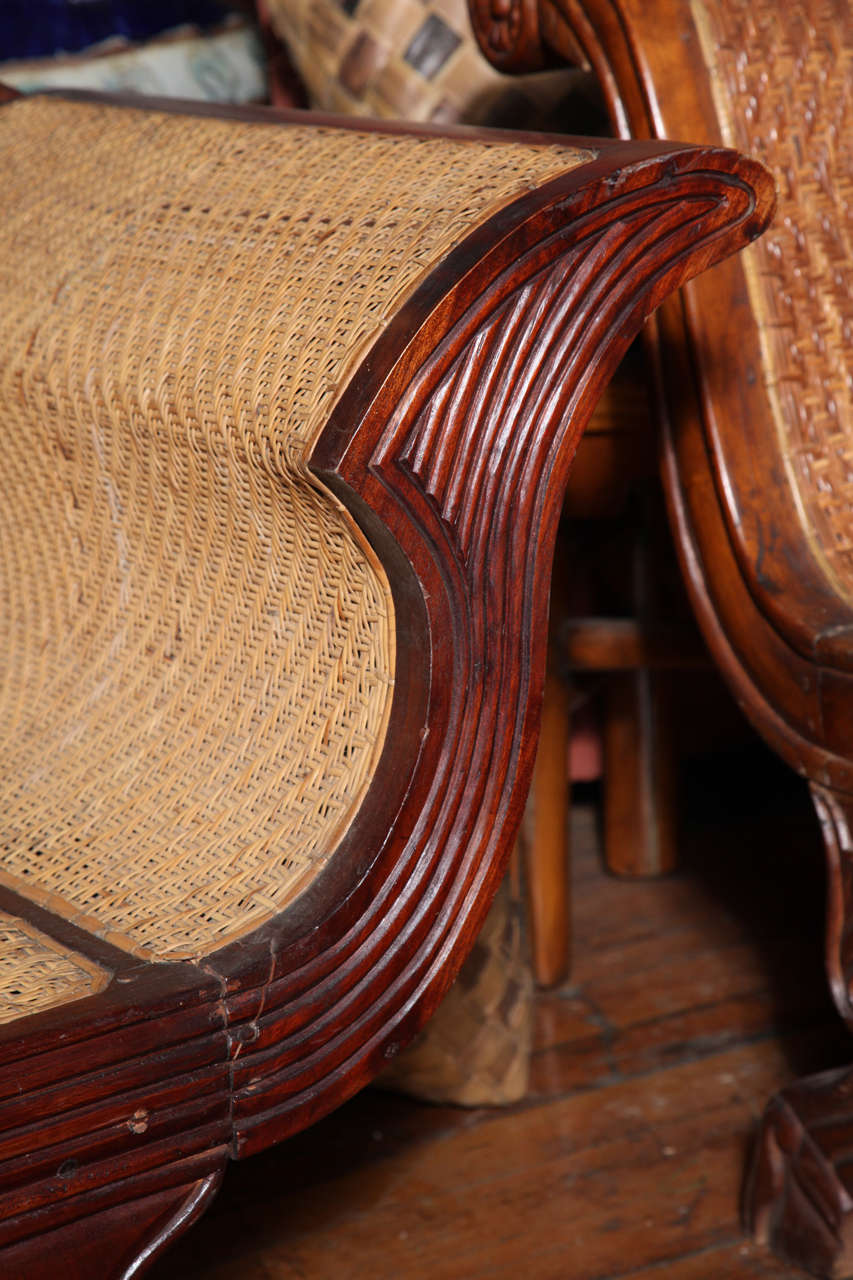 1930s Dutch Colonial Teak Sofa with Wavy Back, Paw Feet and Rattan Upholstery In Excellent Condition In Yonkers, NY