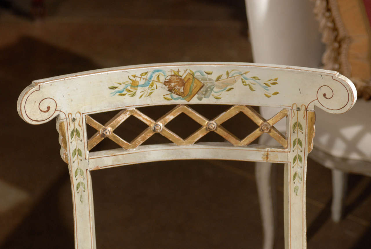 Painted Set of Four Italian 1790s Neoclassical Period Music Chairs with Gilded Trellis