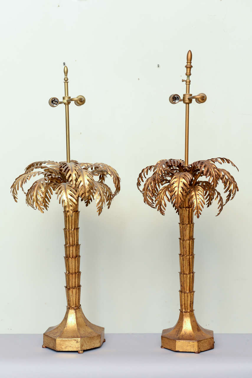 Rare pair of gilded iron palm tree lamps, each having octagonal footed base.  By Warren Kessler.