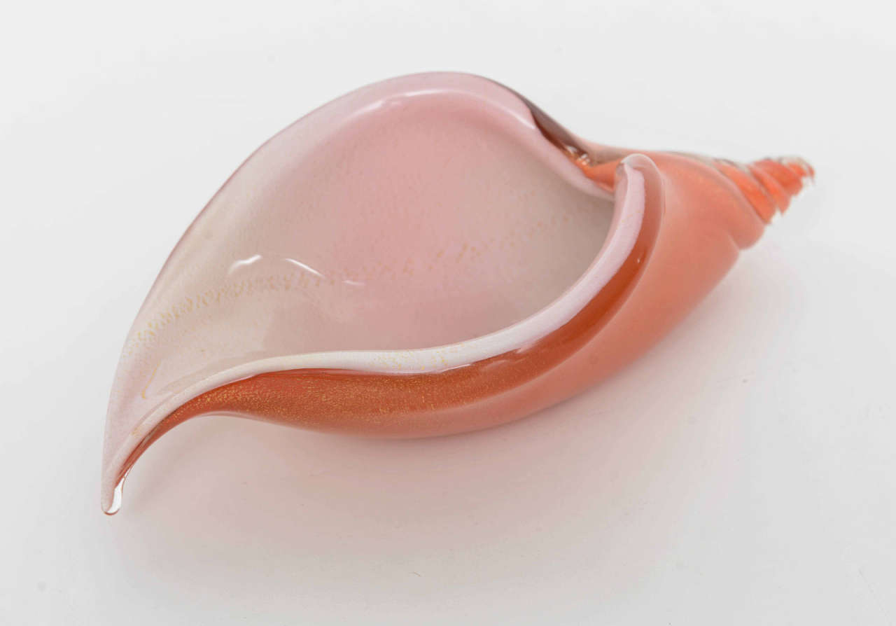 Mid century hand blown Murano glass Salviati cornucopia shell dish in orange with white.
