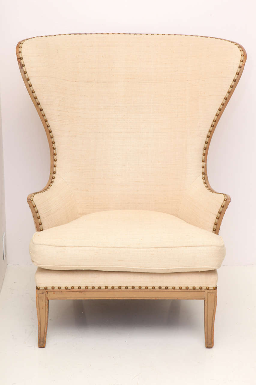 Near pair of chairs:
1st is a vintage Grosfeld House model with wood frame from the 1940s.
2nd is a reproduction model to go en suite
Both upholstered in Larsen linen fabric with nailhead trim.
