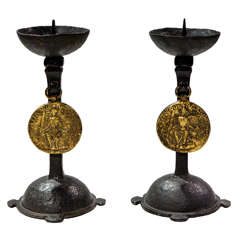 An Early Pair Of Iron Candlestick With Medallion