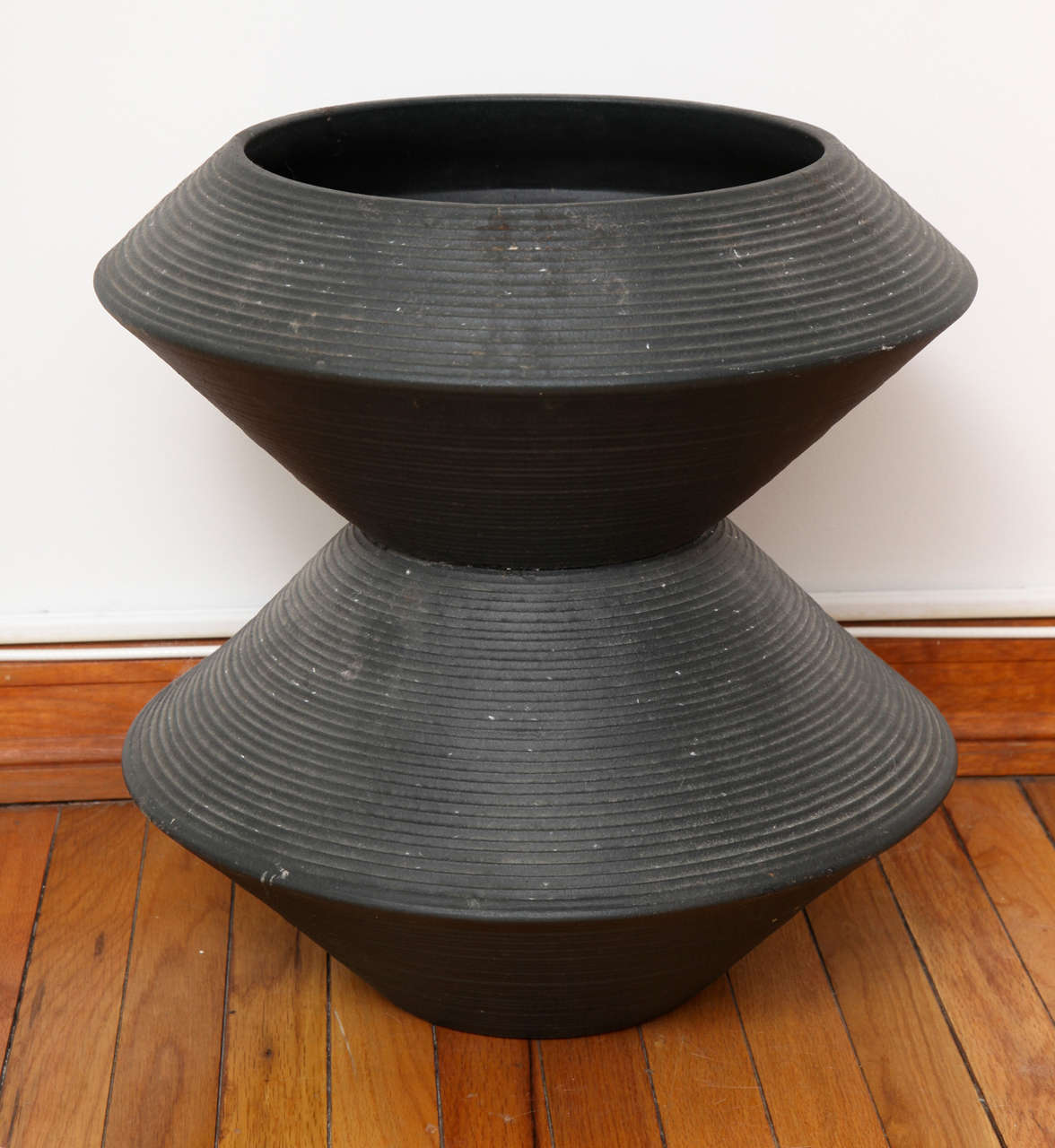 Mid-century ceramic jardiniere in matte black finish. In the style of La Gardo Tackett's stacked totem forms for Architectural Pottery.