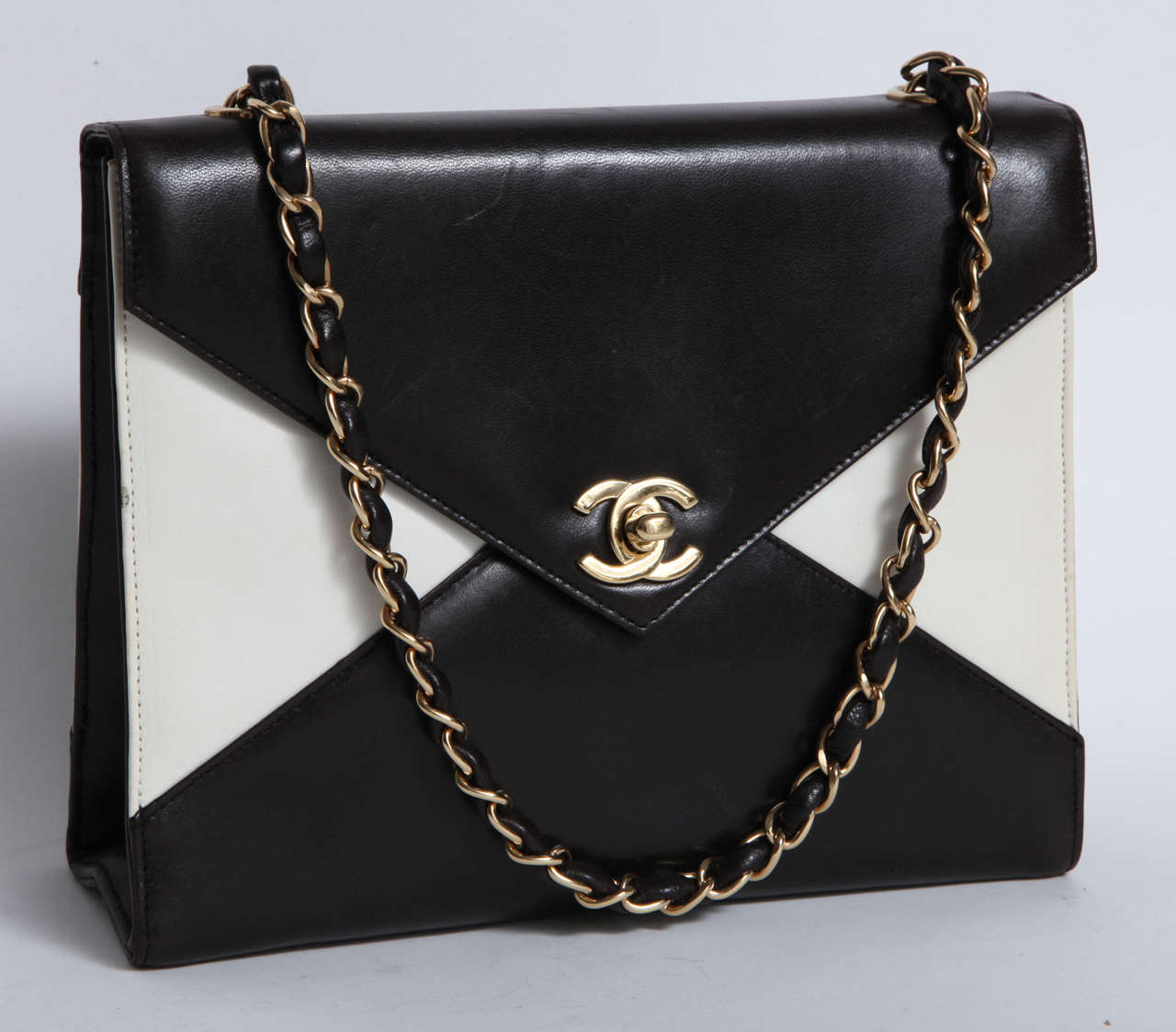 A stylish vintage black and white Chanel bag with 15