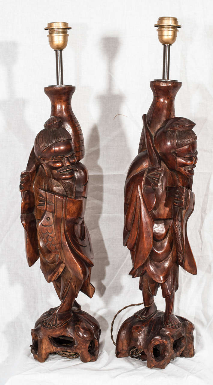 Late 19th century pair of hand-carved table lamps.