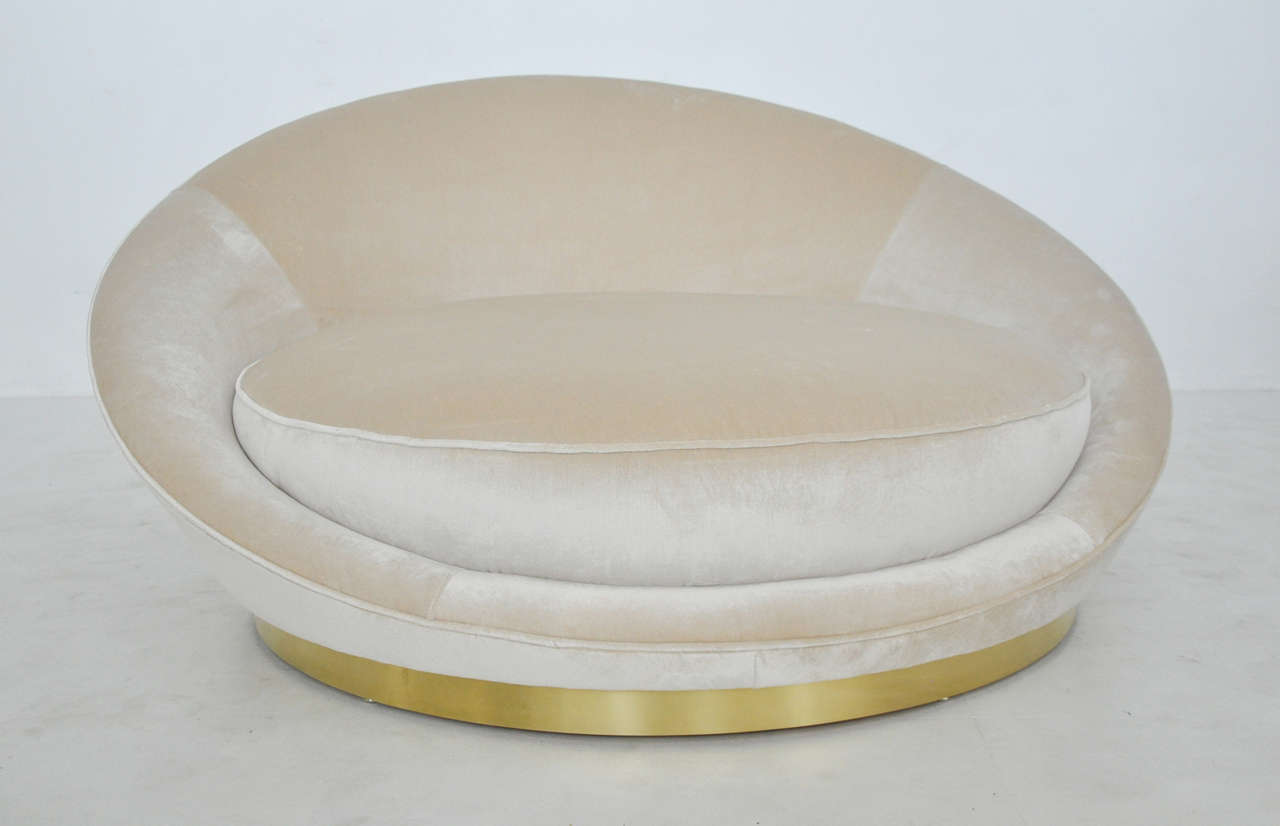 Large circular loveseat by Milo Baughman.  Newly upholstered in silk velvet over brass base.
