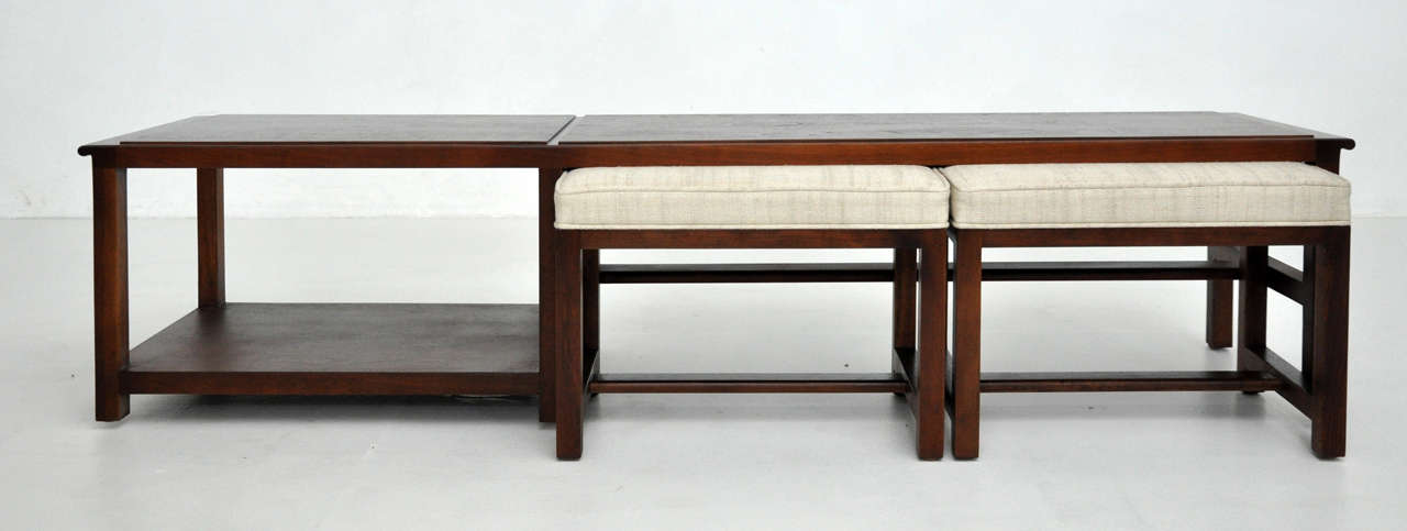 Walnut coffee table with matching stools.  Designed by Edward Wormley for Dunbar.  Newly upholstered.
