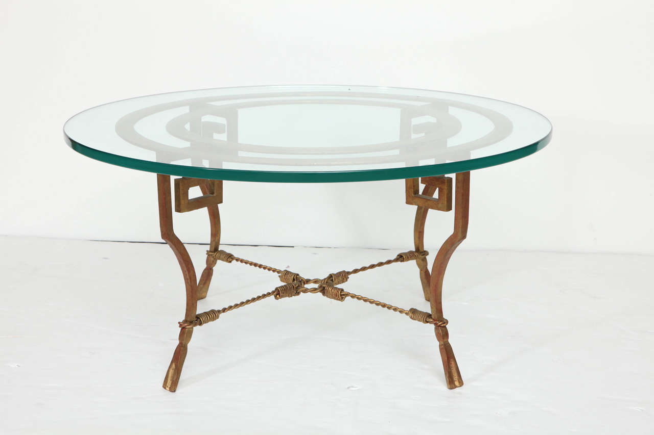 Gilt wrought iron neoclassical coffee table.