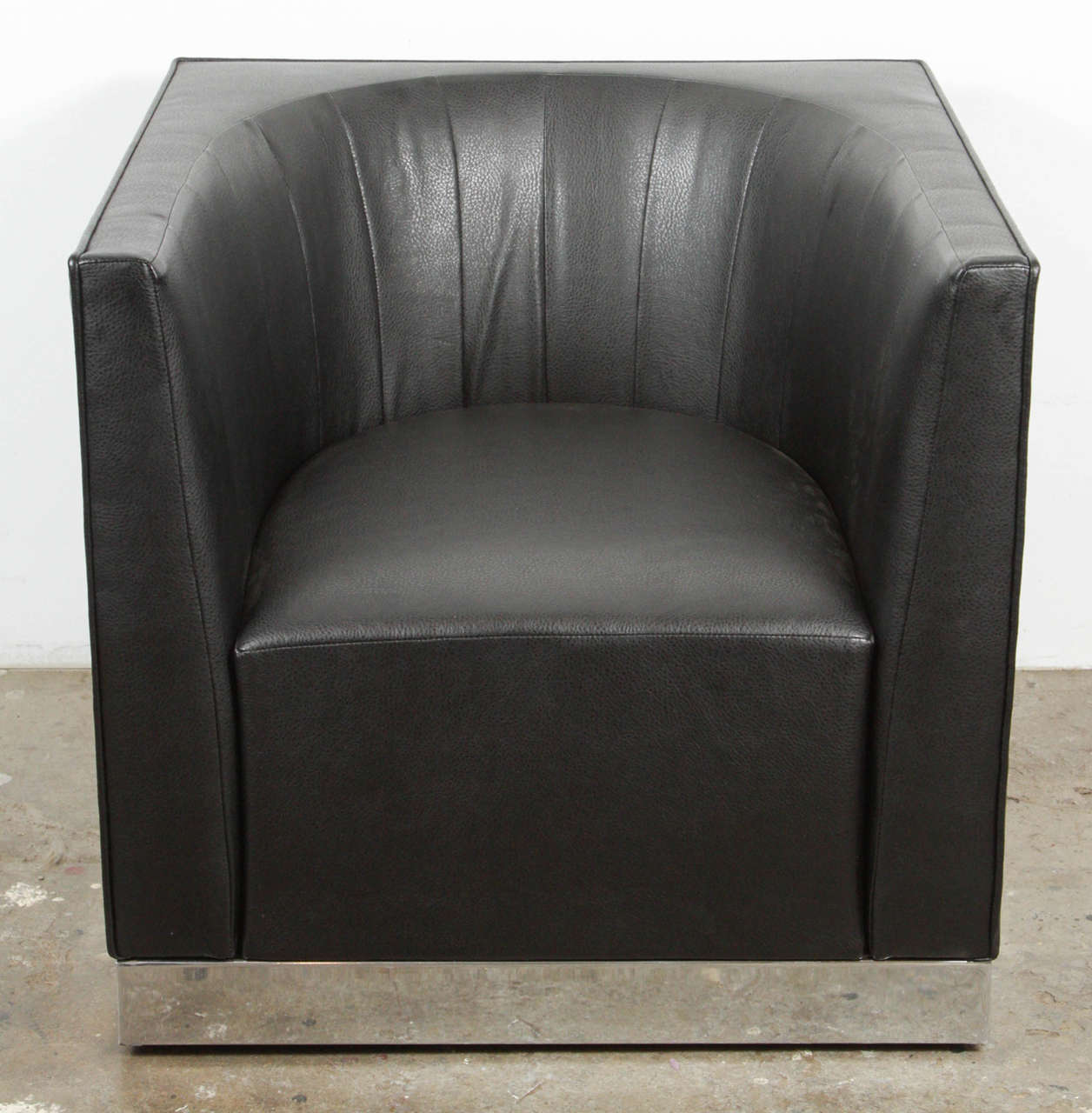 Vintage black leather and chrome base designer club chair in excellent condition. Attributed to Milo Baughman. Has a deco modern look. Heavy chairs, very high quality. Buy individually or up to six in total. Great lines, fantastic design.