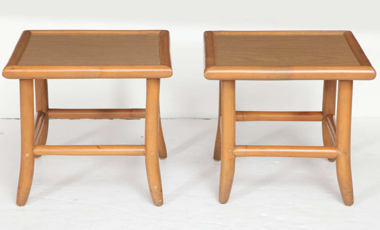 Pair of vintage bamboo low tables with laminate top.  USA, circa 1960.  Versatile tables may be used as low cocktail or drinks tables or as end / side tables.
