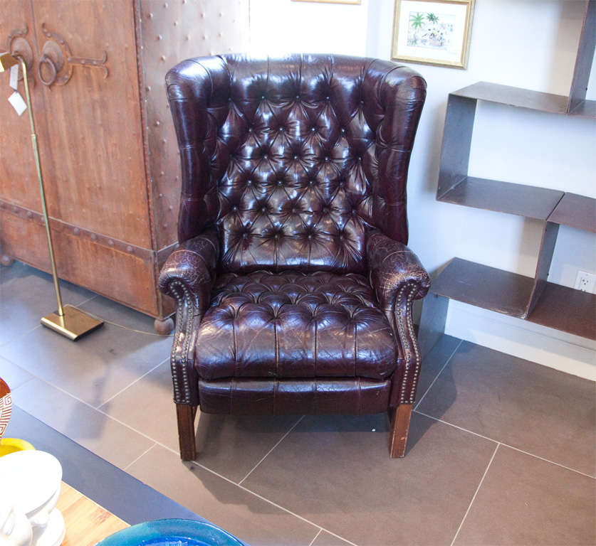 This stunning leather Chesterfield recliner is in beautiful condition with a shiny patina -- both comfortable and elegant